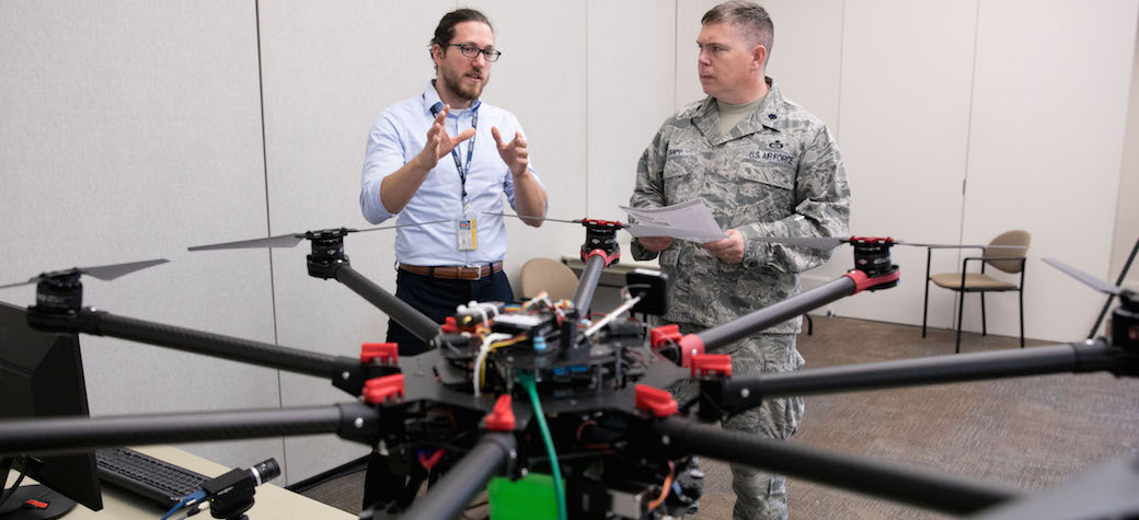 two researchers with UAV