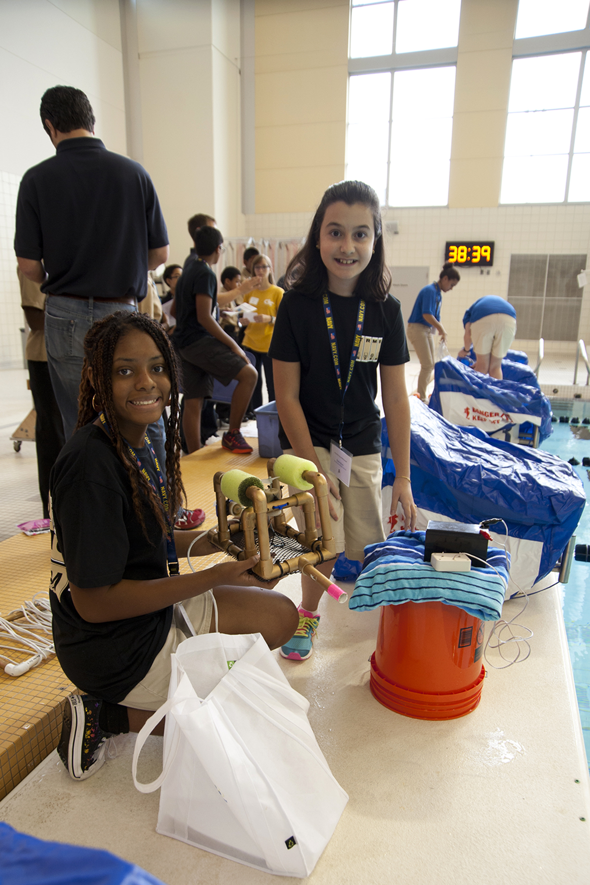 Student competitors work on their underwater ROV during the competition.