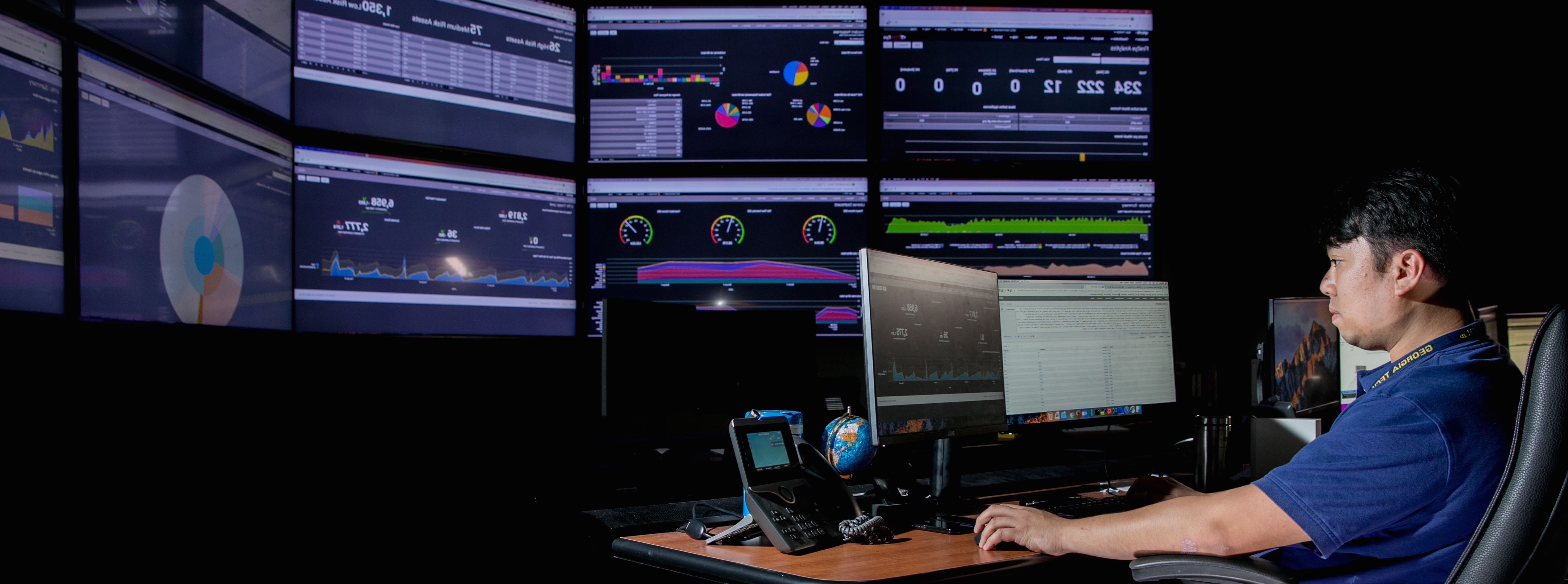 researcher in front of monitors