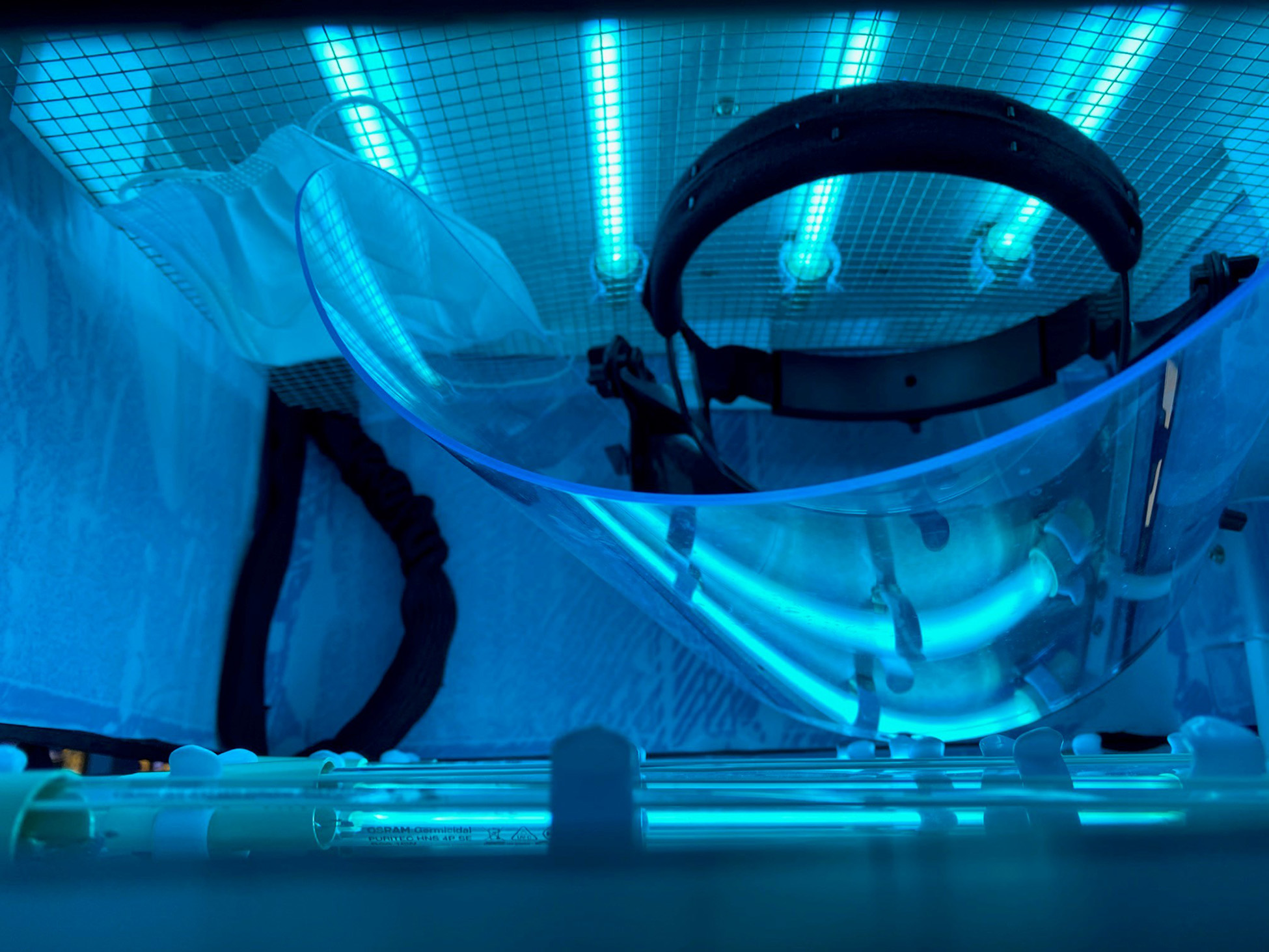 The portable UV disinfection chamber was designed to accommodate at least one face shield, along with multiple face masks. Mercury vapor tubes on both sides provide ultraviolet light to disinfect the PPE. (Credit: Robert Harris)