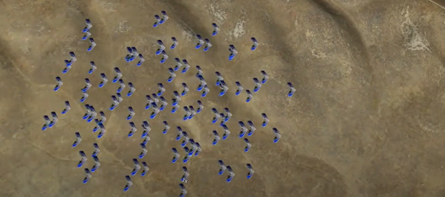 A simulated aerial view of aircraft flying over a valley.