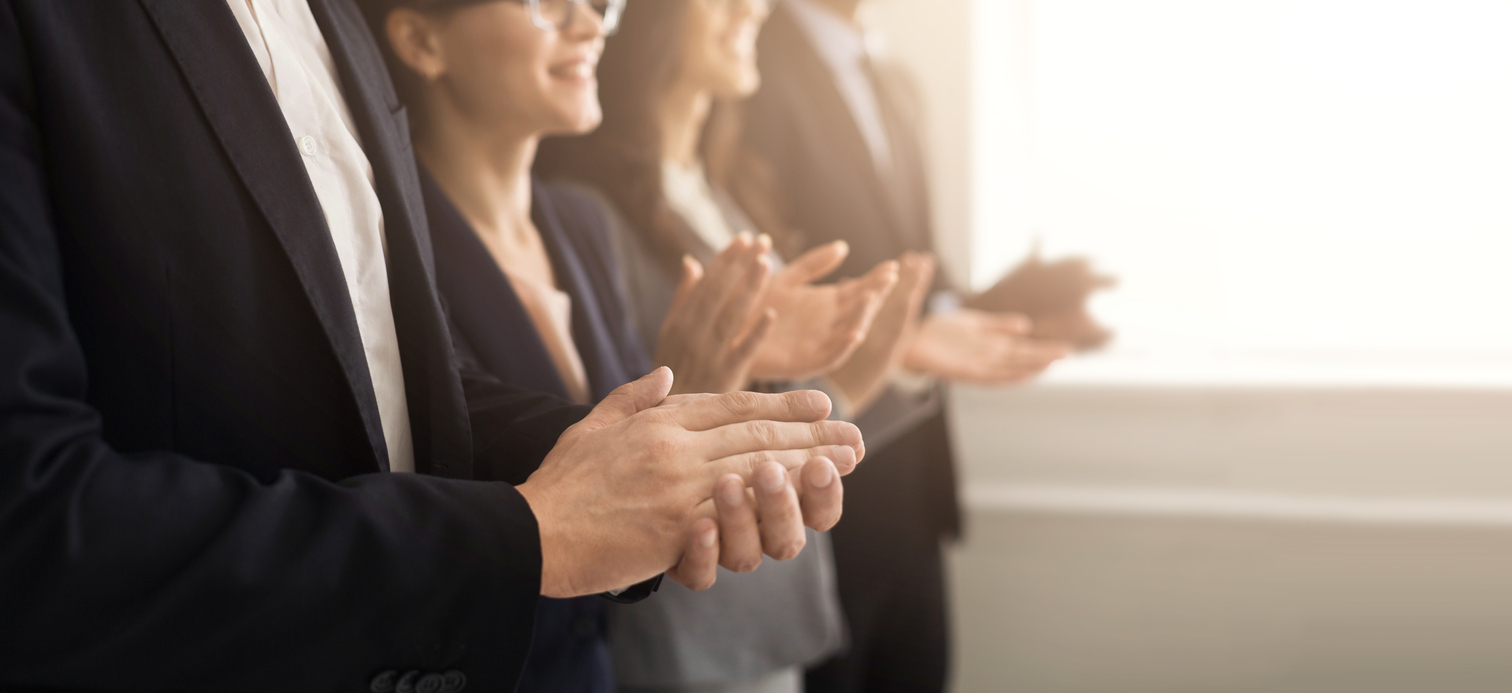 Group of People applauding (Credit: iStock, Prostock-Studio)