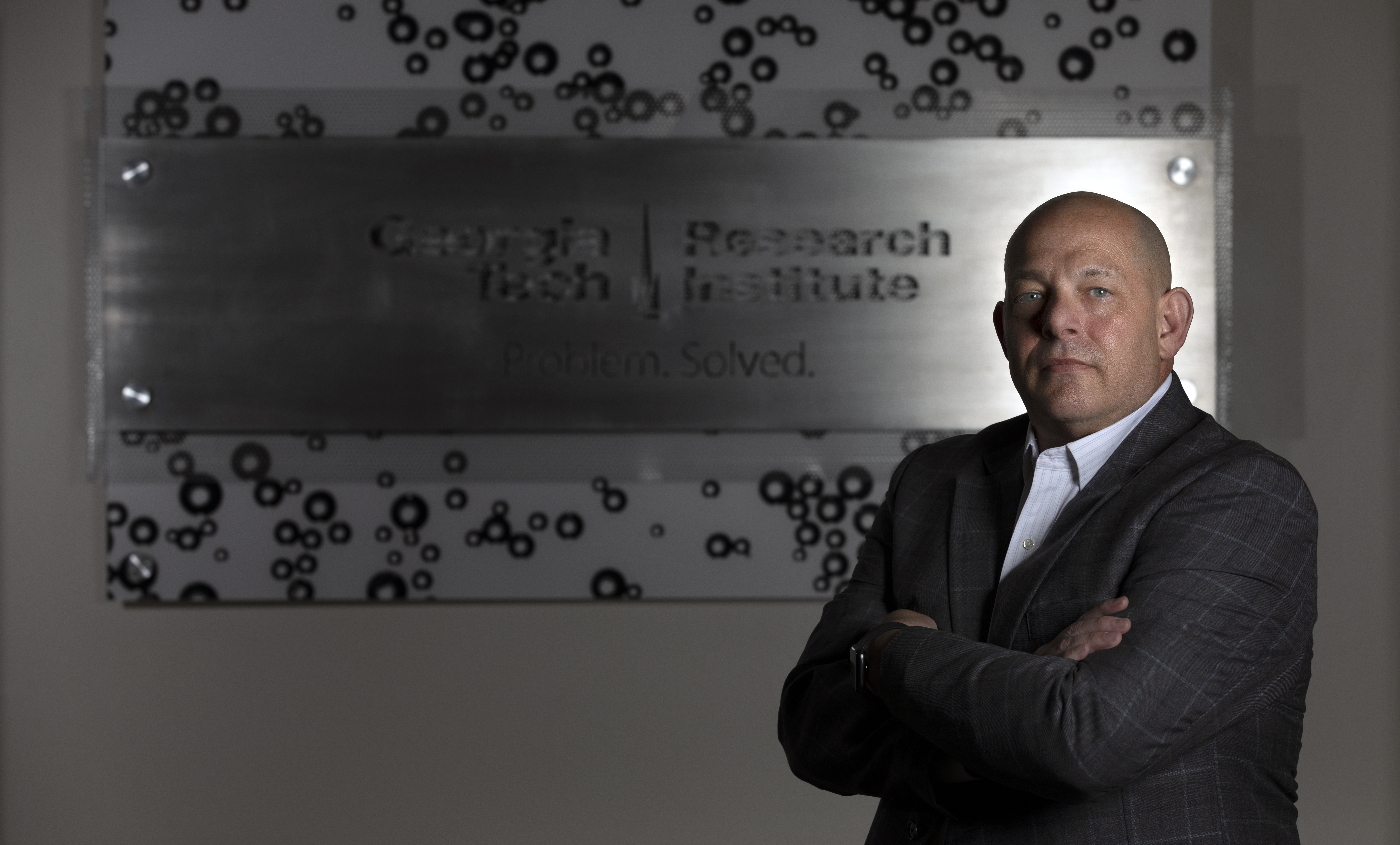 Erik Andersen standing in front of a GTRI sign.