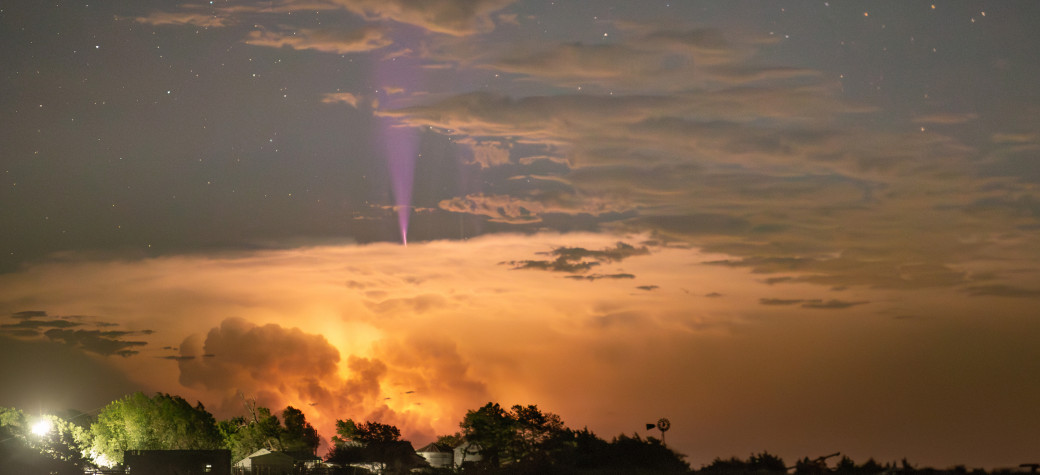 Blue jet rising above a thunderstorm.