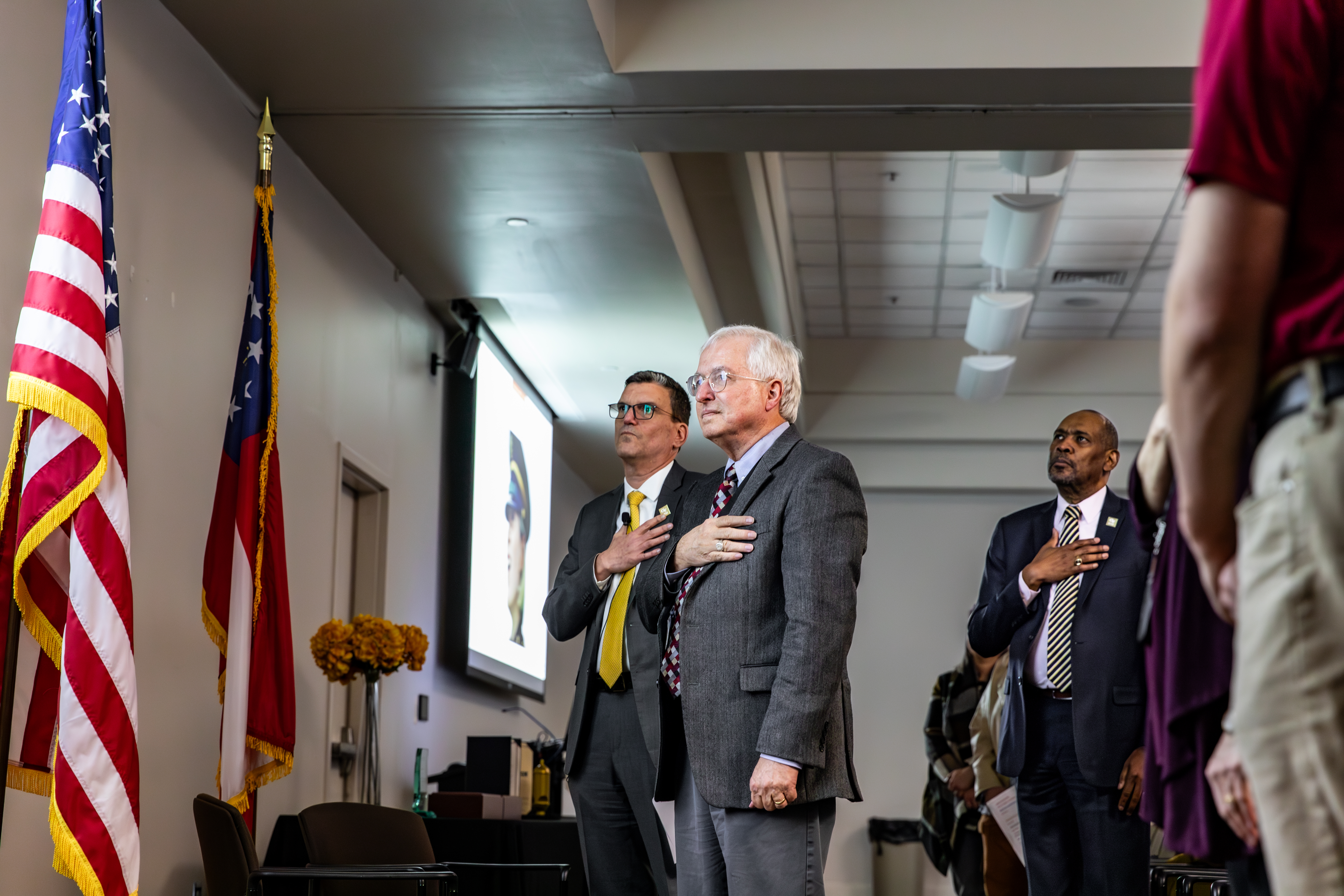 GTRI employees salute the American flag